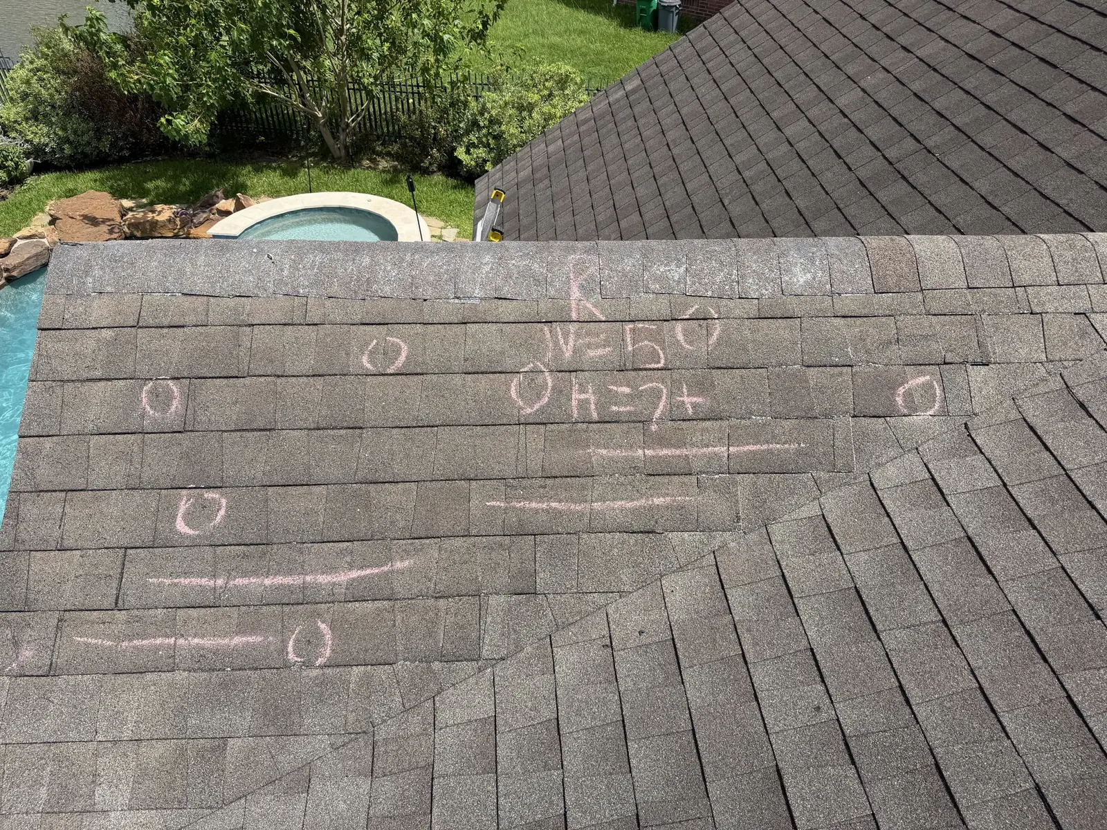 Hail hits chalk-marked during an inspection