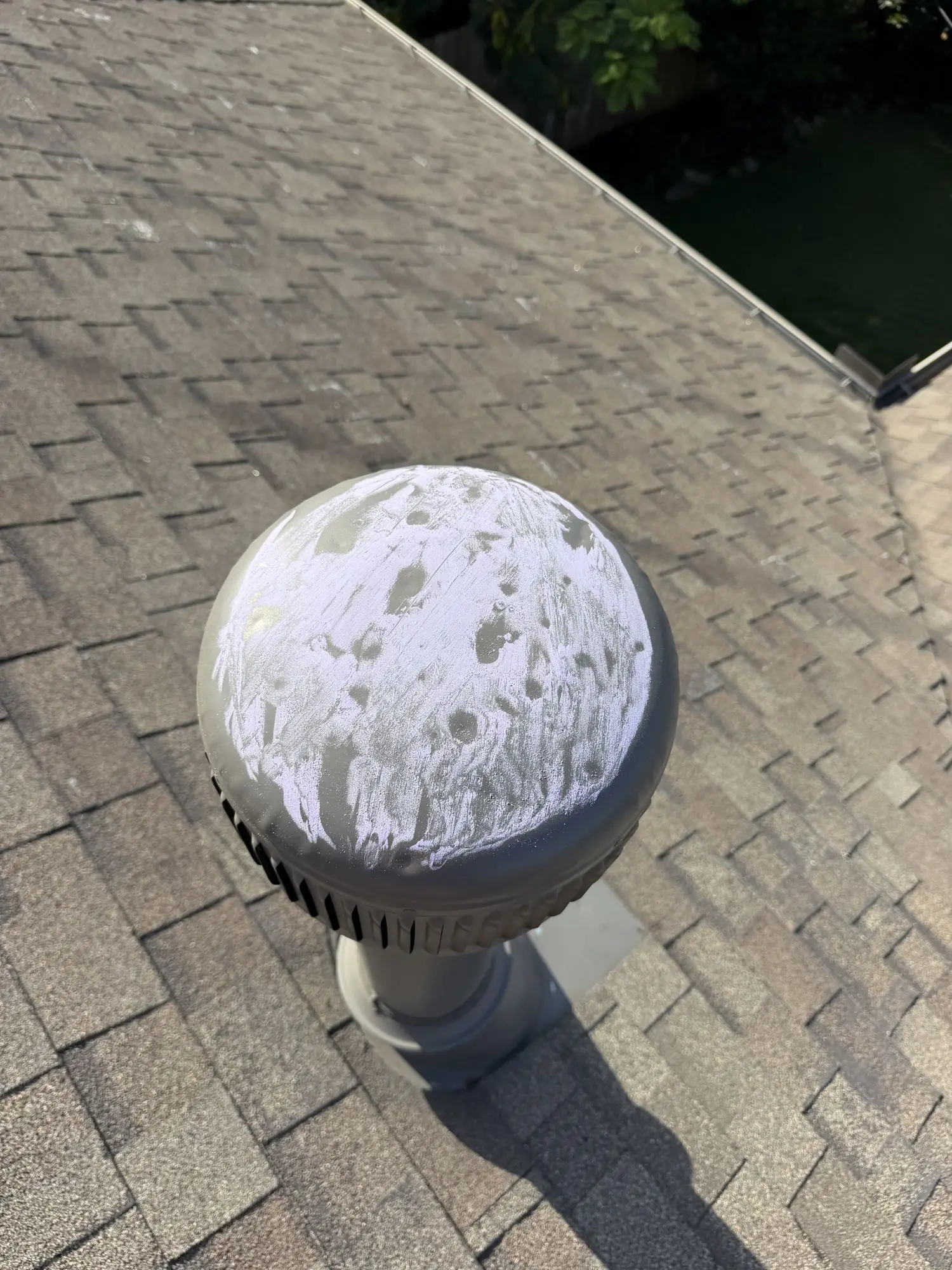 Hail-dented turbine vent, a sign of roof damage